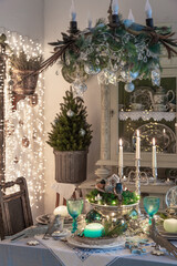 Christmas or New Year festive  table setting with vintage decoration. Holiday dinner in retro living room.