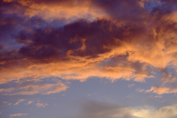 Fototapeta premium Sunset sky with orange clouds. Nature background.