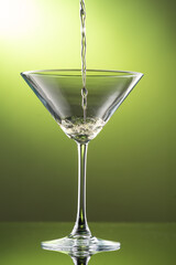 martini glass on green background