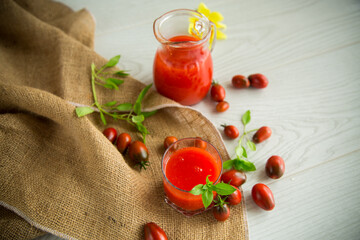 homemade freshly squeezed tomato juice with pulp in a glass decanter