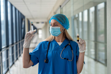 nurse in uniform with a stethoscope around his neck holding syringe in front of patient's ward