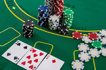 The game chips and palying cards for betting in gambling