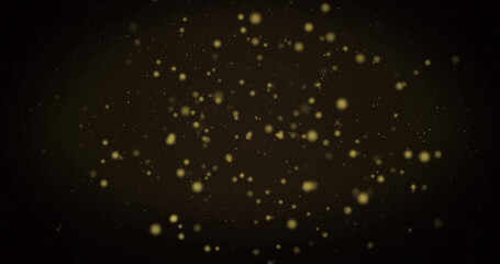 Image of warm glowing yellow spots floating on black background