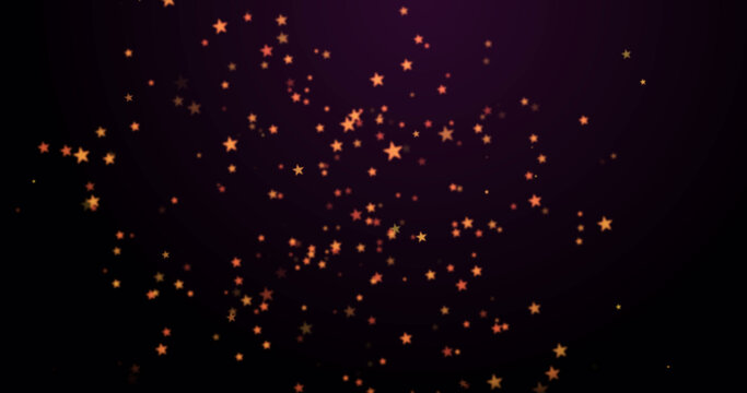 Image of warm glowing orange spots floating on black background
