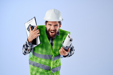 male worker in a white helmet blueprints Professional studio industry