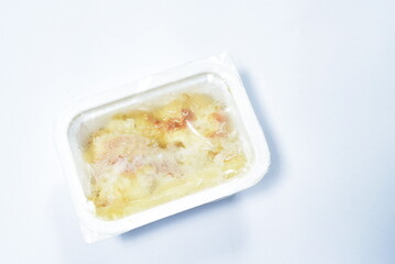 frozen food ready to eat meal in plastic packaging defrost for warming on white background