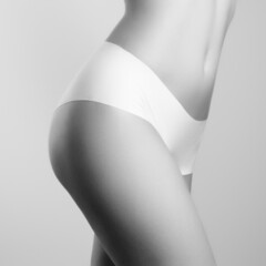 Beautiful slim woman's body. Perfect slim toned young body of the girl. Fitness or plastic surgery...