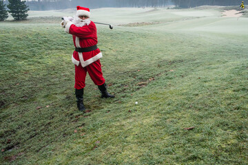 Santa Claus playing golf.