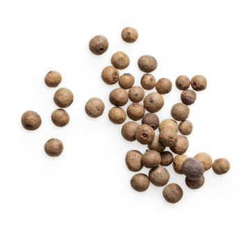 Isolated scattering of allspice on white background 