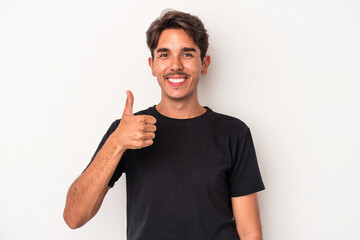 Young mixed race man isolated on white background smiling and raising thumb up