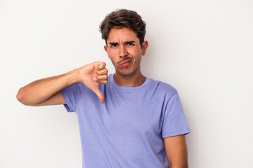 Young mixed race man isolated on white background showing thumb down, disappointment concept.