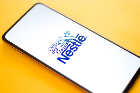 West Bangal, India - October 09, 2021 : Nestle logo on phone screen stock image.