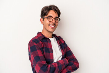 Young mixed race man isolated on white background who feels confident, crossing arms with determination.