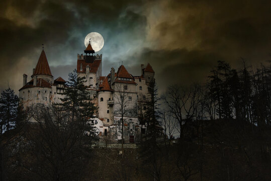 Moon in the clouds over Bran Castle, Transylvania, Romania. Medieval  building, Dracula's Castle. Mystical night landscape. Stock Photo | Adobe  Stock