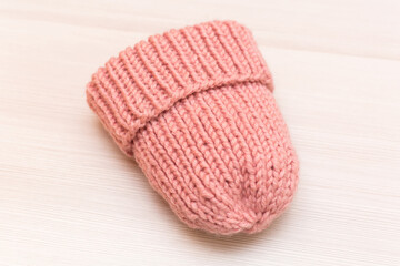 Pink women's wool hat on white background