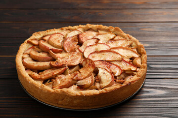 Fresh delicious apple pie on wooden table