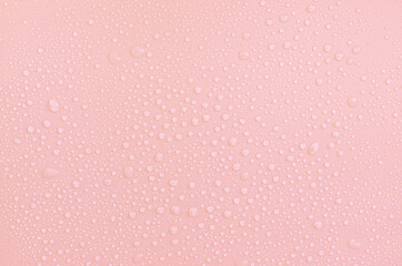 water droplets on pastel pink powdery backdrop background