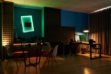 Interior of podcast studio with neon illumination
