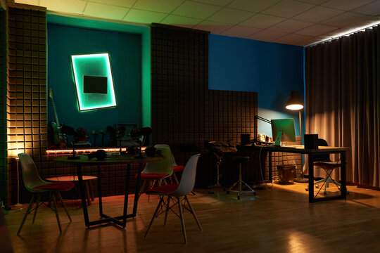 Interior of podcast studio with neon illumination