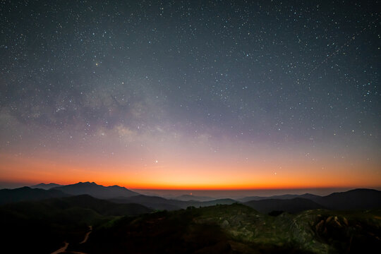 Panorama view universe space shot of milky way galaxy with stars on night sky background at mountains landscape Thailand