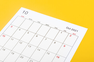 October 2012 calendar sheet on yellow background.