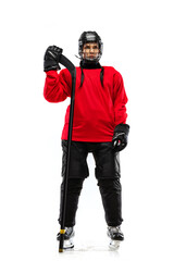 Full-length portrait of woman, professional hockey player in special protective uniform with helmet...
