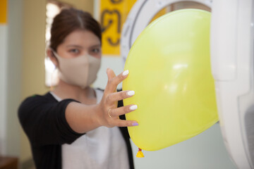 Thai girl with yellow balloon