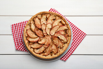 Delicious apple pie on white wooden table, top view