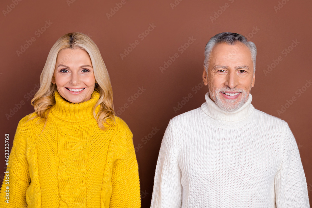 Sticker Photo of optimistic couple blond elder lady grey hairdo beard man wear yellow white sweater isolated on brown color background