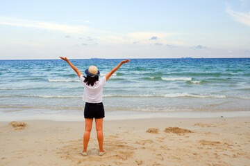 Young asia woman sitting resting on tropical Beach