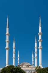 Fototapeta na wymiar Image of the six minarets of a Muslim mosque in southern Turkey with Ottoman architecture