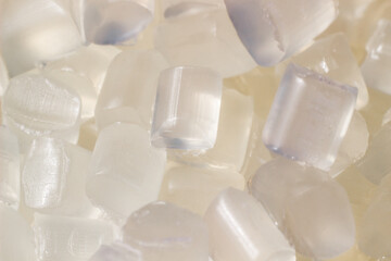 Transparent granules of polypropylene or polyamide. background. Plastics and polymers industry. 
