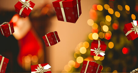Image of presents falling over christmas tree