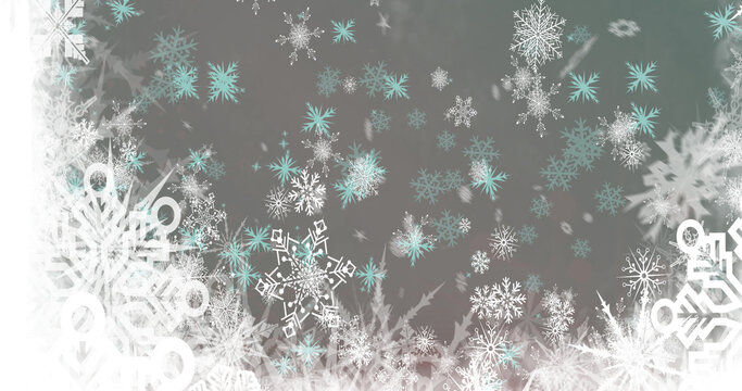 Image of snow falling over christmas snowflakes on grey background
