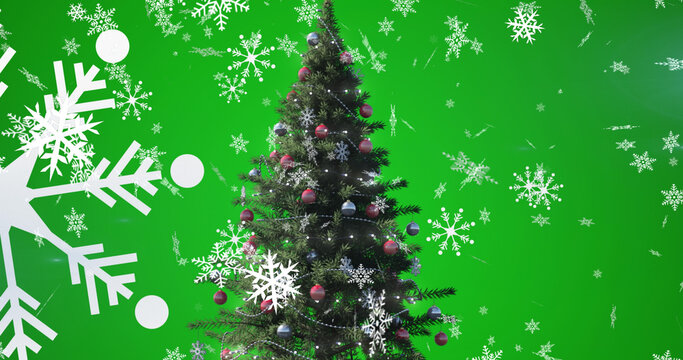 Image of falling snowflakes over christmas tree