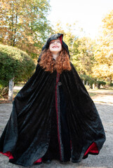 Naklejka premium a girl in a witch costume for Halloween