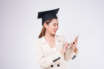 Portrait of young woman graduated over white background.