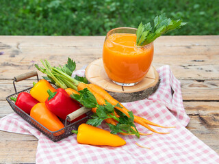 Fresh squeezed vegetable smoothie juice bell pepper, carrot in a glass. Healthy eating, detox, dieting. 