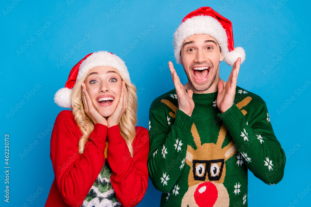 Sticker photo portrait couple smiling in sweaters headwear amazed isolated pastel blue color background