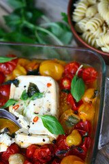 Feta tomato pasta cooking. Delicious popular dish. Italian food.