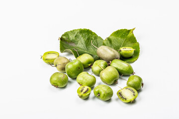 Ripe Actinidia arguta or kiwi isolated on white background