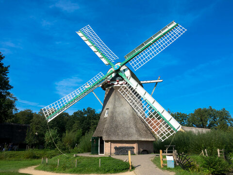 Historical traditional dutch windmill in summer. Arnhem, Provinz Gelderland, The Nederlands. Tourism and vacations concept.