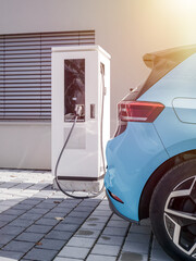 environment friendly electric car at charging station