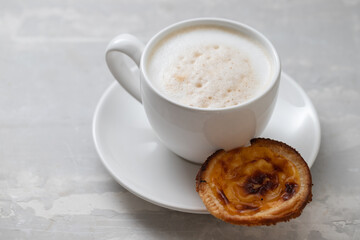 typical portuguese dessert pastel de nata with coffee