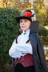 a little boy in a vampire costume for Halloween