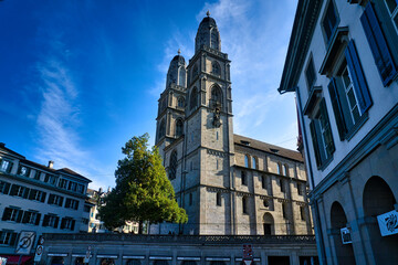 Fototapeta premium Zurich, Switzerland, view to Church Grossmünsterr from Munsterbrucke
