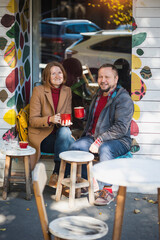 man and a woman in a cafe drinking coffee