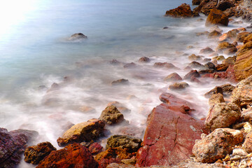 Fototapeta na wymiar Long exposure tropical rocky beach