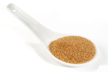 Cinnamon Sugar on a Porcelain Spoon isolated on white Background