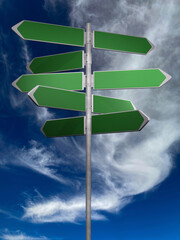 green directionl signs on a blue sky background